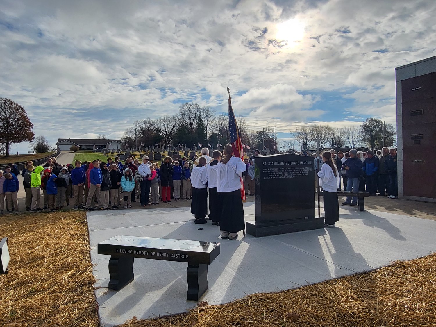The students of St. Stanislaus School and a group of parishioners gather in St. Stanislaus Cemetery in Wardsville for the blessing of the new veterans memorial.